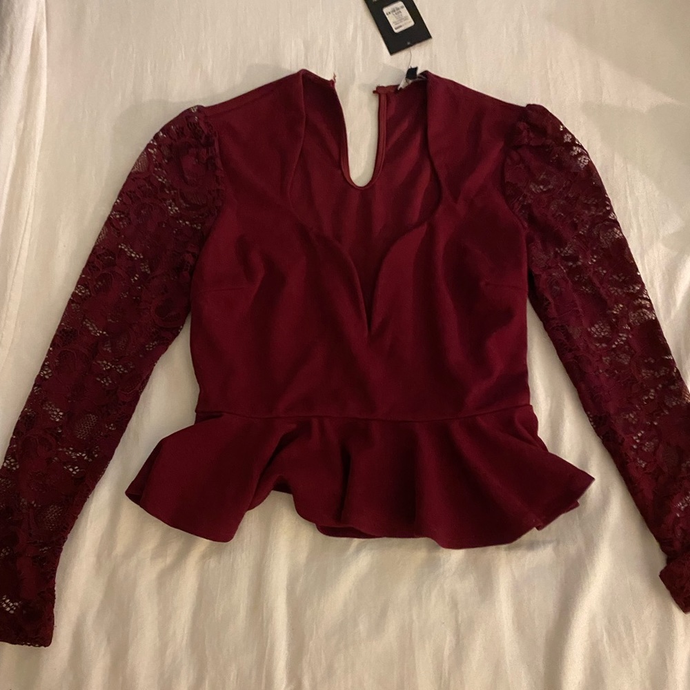 Fashion nova deep V shirt, needs a button in the back but it’s a quick fix